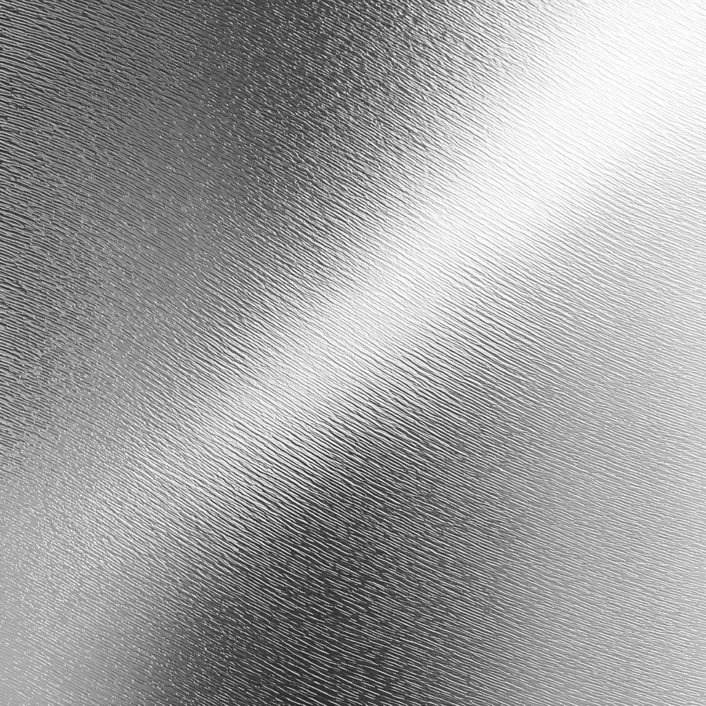 Raking light across a brushed metallic surface