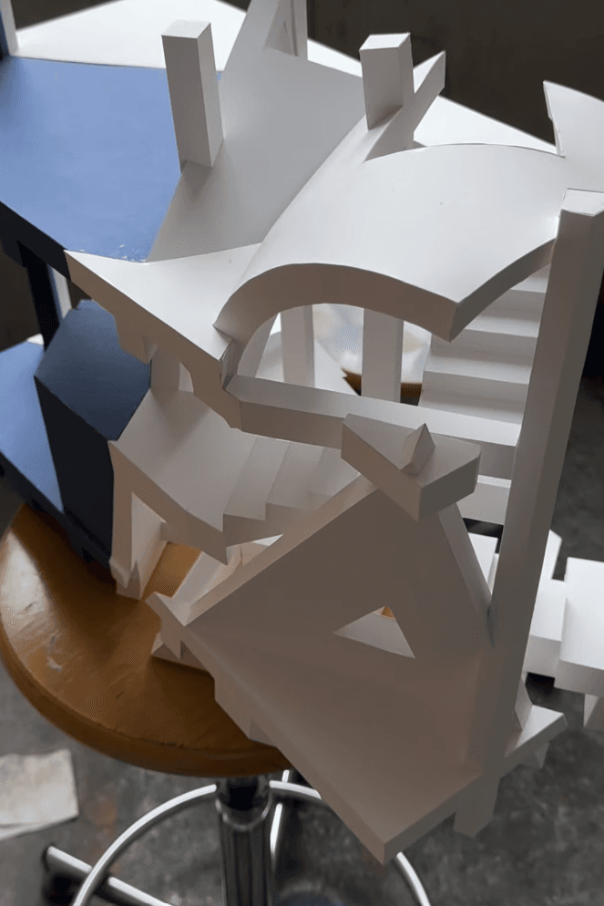 White geometric paper model on a table